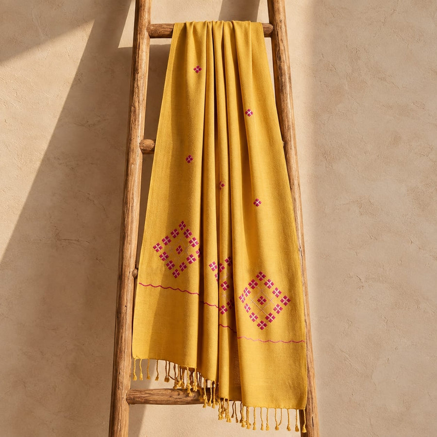 Warmth, woven by hand.